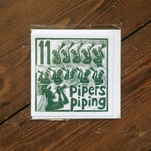 Load image into Gallery viewer, Eleven Pipers Piping Greetings Card lino cut by Kate Guy
