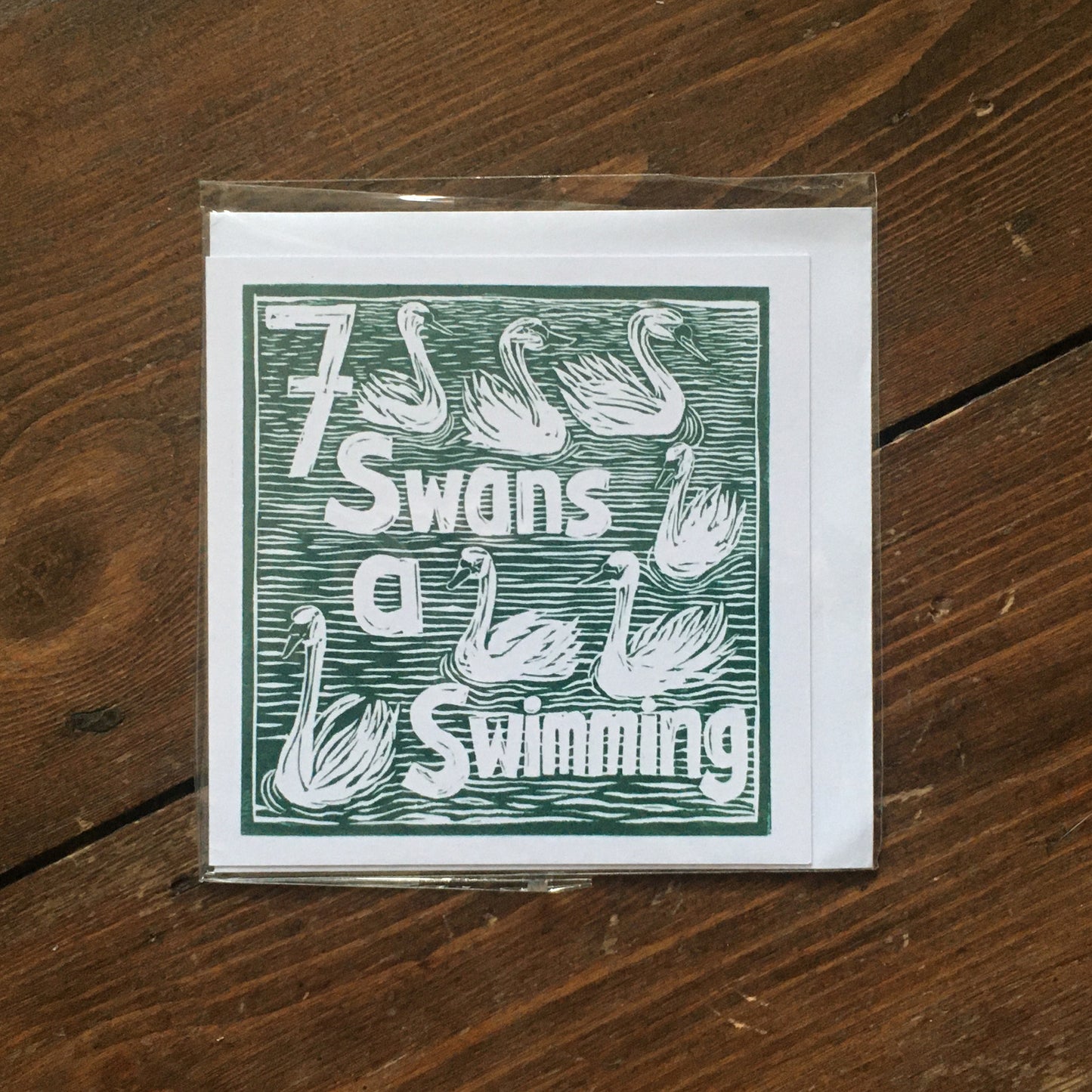 Seven Swans a Swimming Greetings Card lino cut by Kate Guy