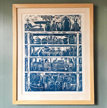 Load image into Gallery viewer, Framed Print of a French Country Kitchen Linocut Print Shelves of Home Grown Produce and Kitchen Equipment in a French Blue
