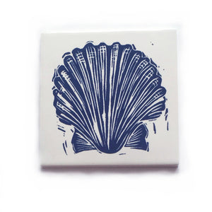 Scallop shell handmade tile in dark blue on cream, lino cut print by Kate Guy