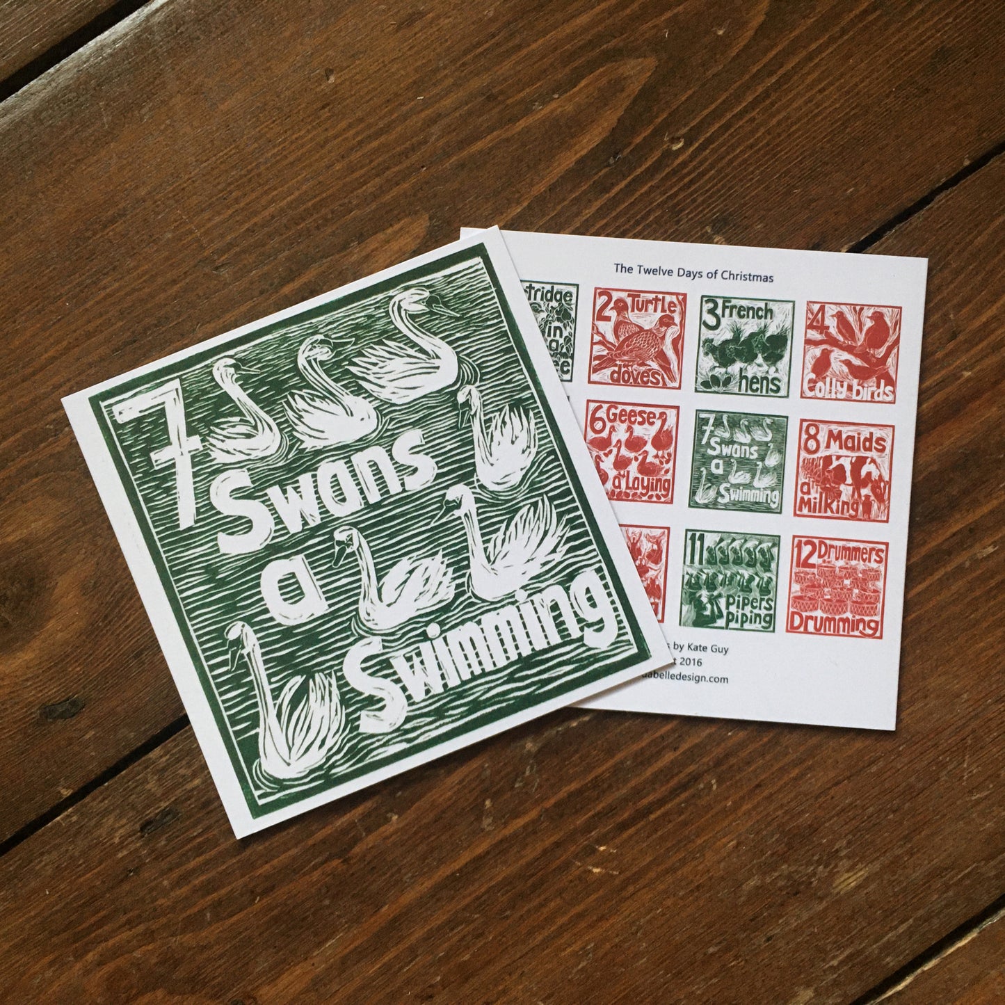 Seven Swans a Swimming Greetings Card lino cut by Kate Guy