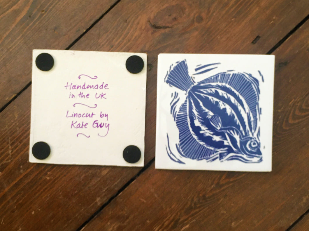 Plaice handmade tile trivet lino cut by Kate Guy showing front and back