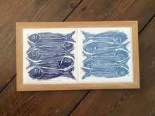 Load image into Gallery viewer, Sardines tile trivets in oak frame lino cut by Kate Guy in dark and pale blue

