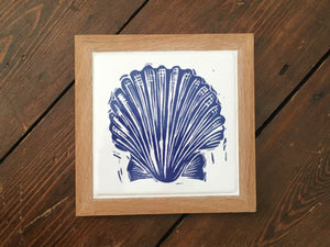 Scallop shell framed tile trivet in Prussian blue lino cut print by Kate Guy