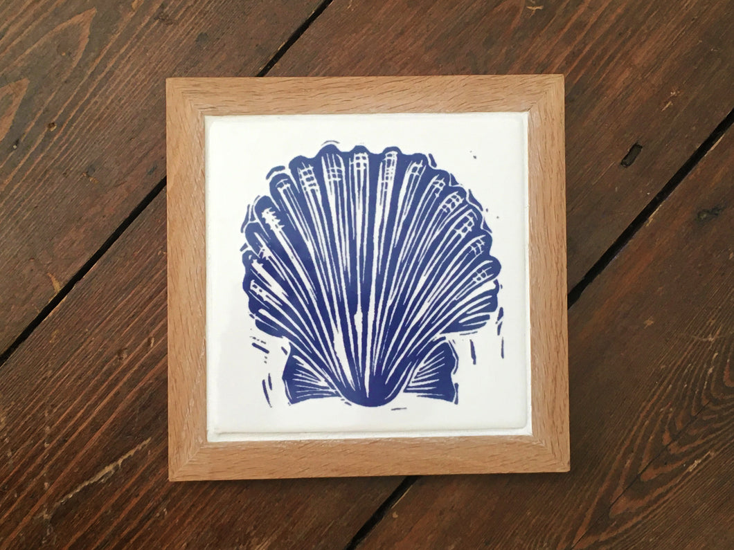 Scallop shell framed tile trivet in Prussian blue lino cut print by Kate Guy