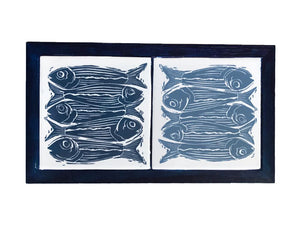 Two Tiles Printed With Linocut Print of Five Fish in Light and Dark Blue Framed in English Oak Painted Dark Blue Trivet by Kate Guy