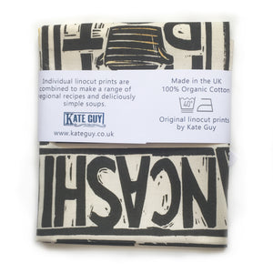Lancashire Hot pot illustrated recipe tea towel lino cut by Kate Guy with cooking instructions in the tag