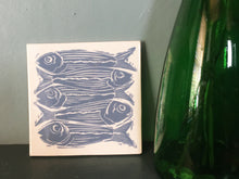 Load image into Gallery viewer, Sardines lino cut handmade tile trivet by Kate Guy
