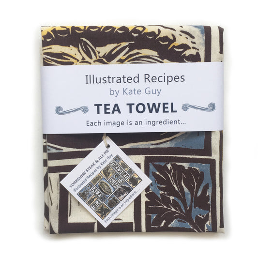 Hand-printed organic cotton tea towel by Kate Guy with Yorkshire Steak and Ale Pie recipe and linocut illustrations of onions, carrots, and ale.