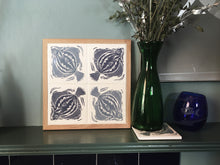 Load image into Gallery viewer, Plaice Handmade tile trivet, table centrepiece. Linocut print of fish on four tiles framed in English oak.
