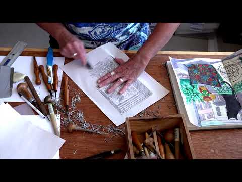 Lockdown cat with Mexican cushion film of the making of a lino cut by Kate Guy