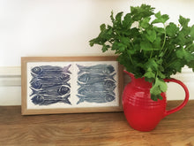 Load image into Gallery viewer, Sardines tile trivets in oak frames lino cut by Kate Guy in dark and pale blue
