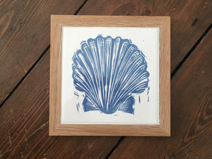 Scallop shell framed tile trivet in pale blue lino cut print by Kate Guy